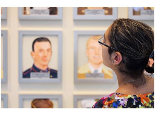 Woman with Wall of Heroes in the Background